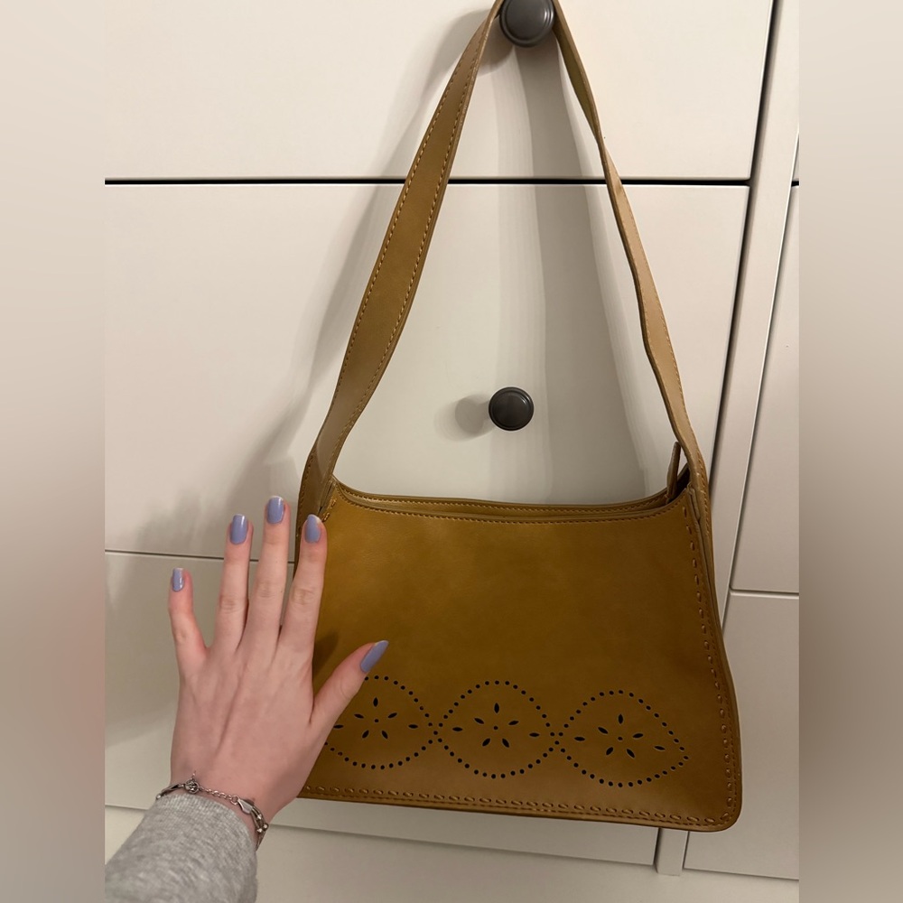 Small leather tan purse with floral details